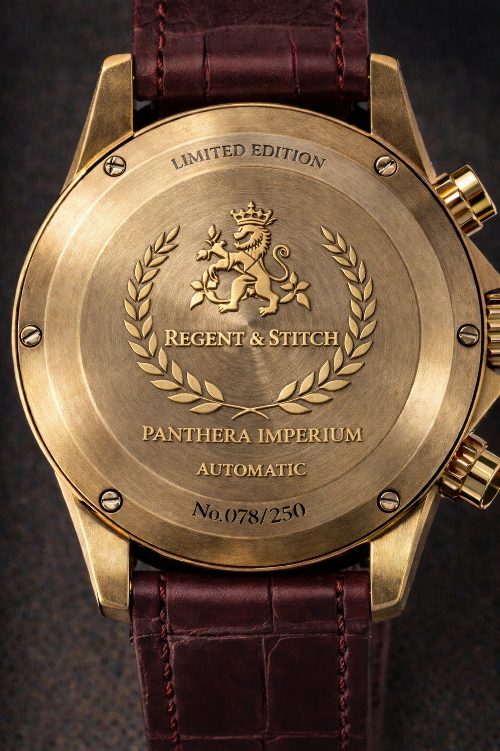 Watch with gold case and brown leather strap, featuring 'Regent & Stitch' branding.